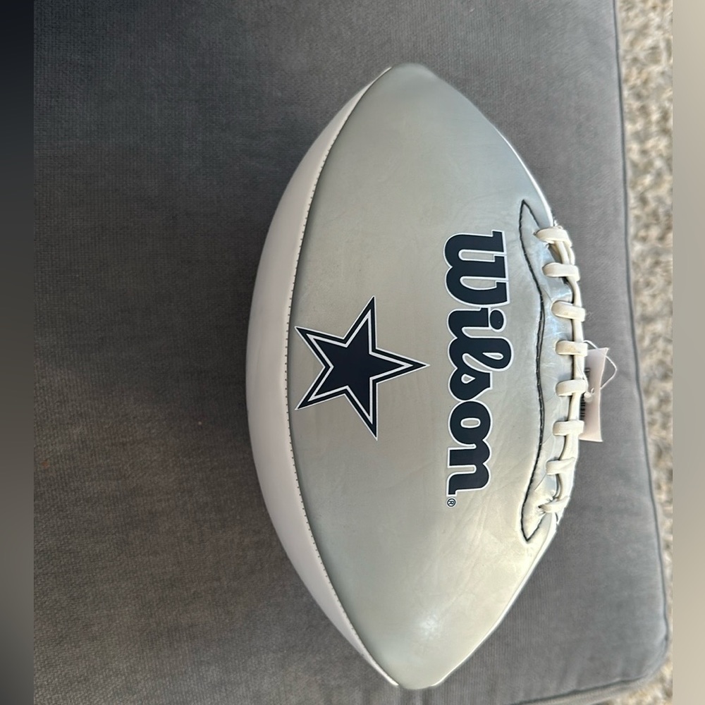 Tony Romo and Jason Witten, autographed Dallas cowboy football.